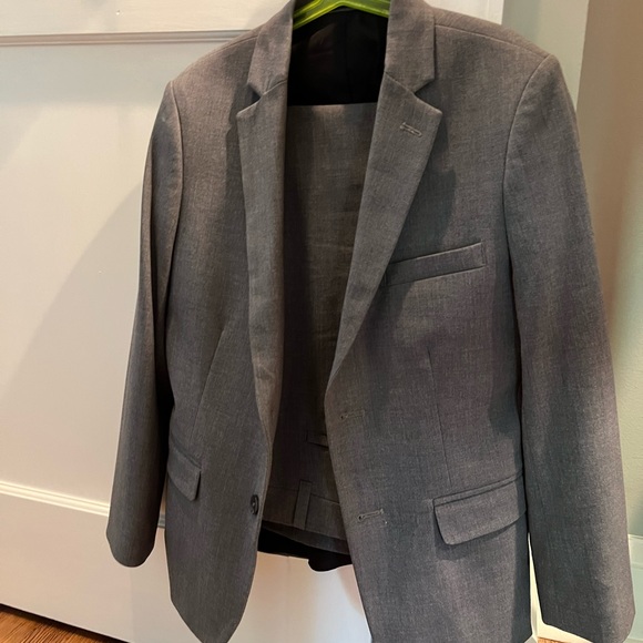 Boys slim stretch fit Calvin Kline gray suit. Size 12 pants/ 14 jacket